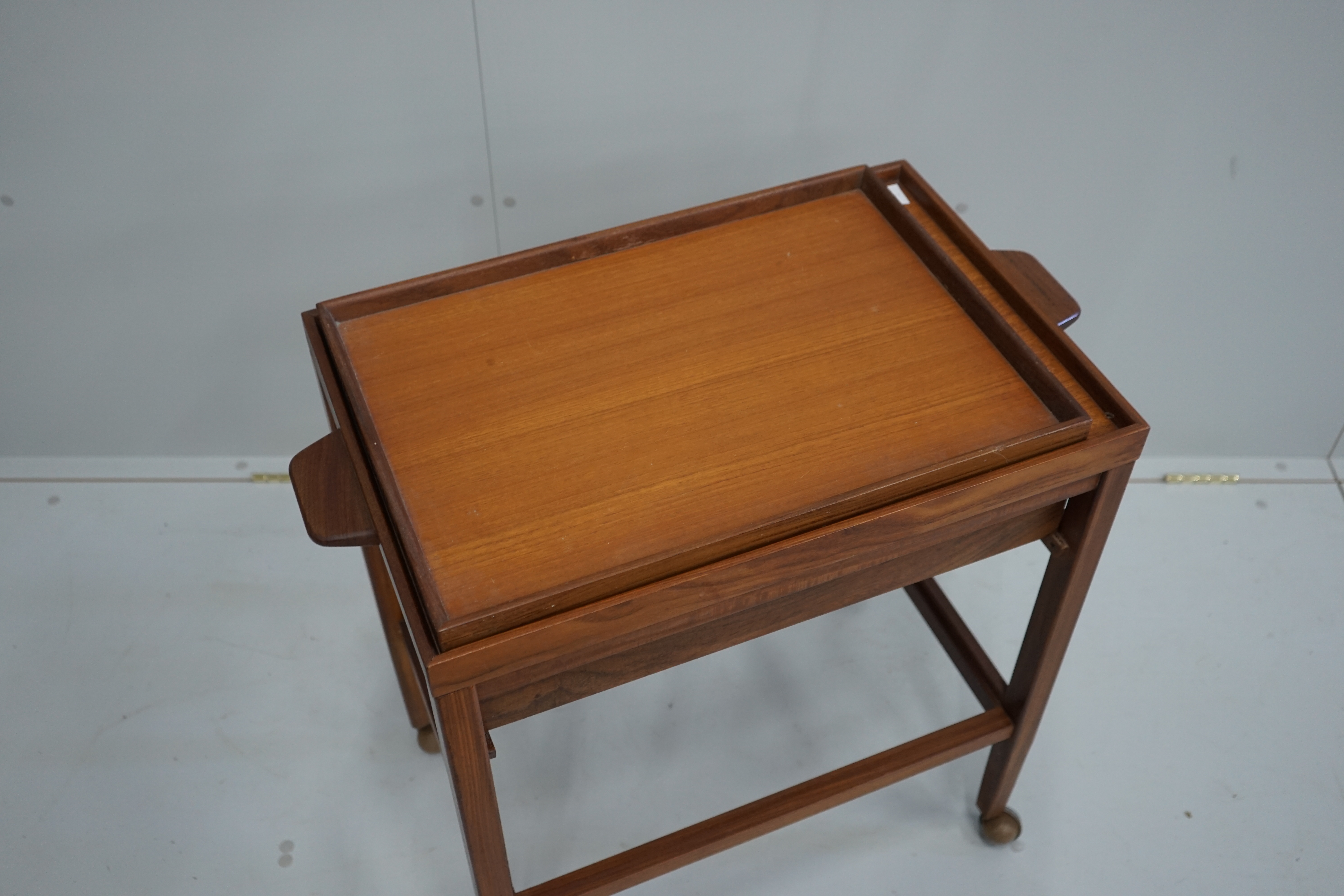 A mid century teak two tier trolley, width 70cm, depth 41cm, height 71cm